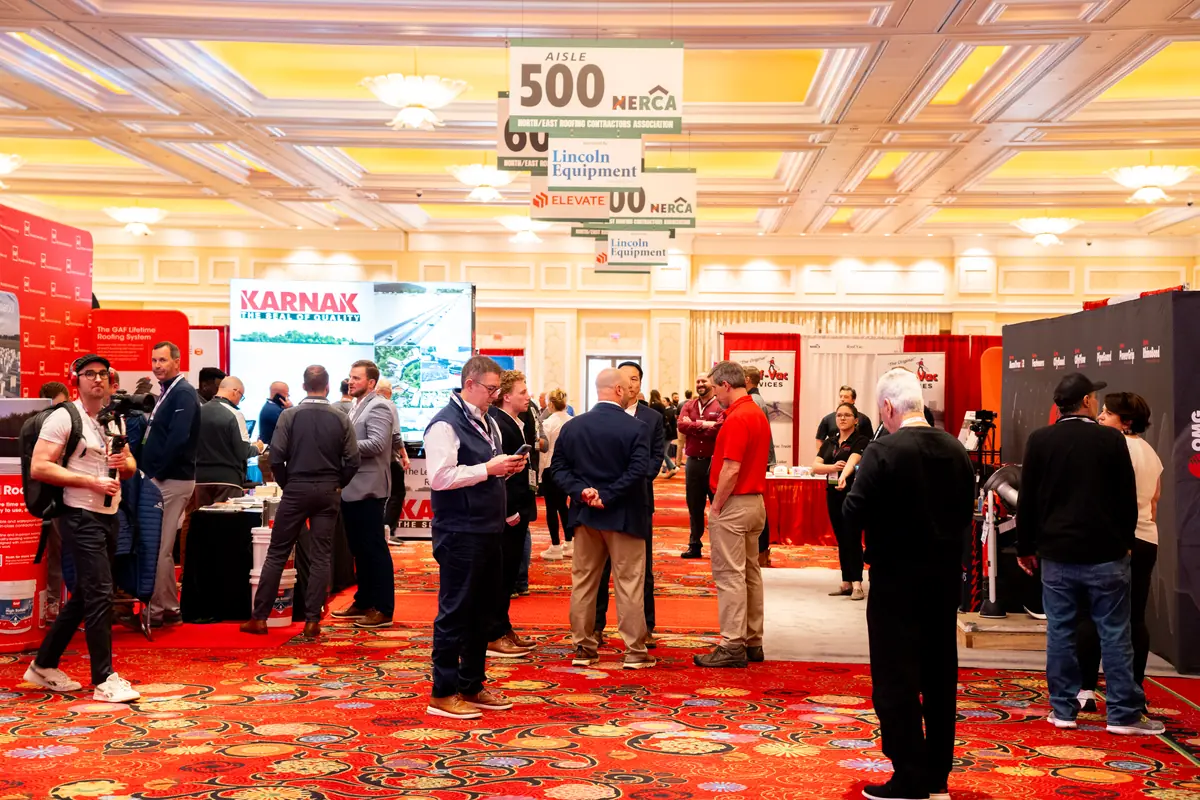 Roofing professionals on the NERCA trade show floor at Encore Boston Harbor in 2024